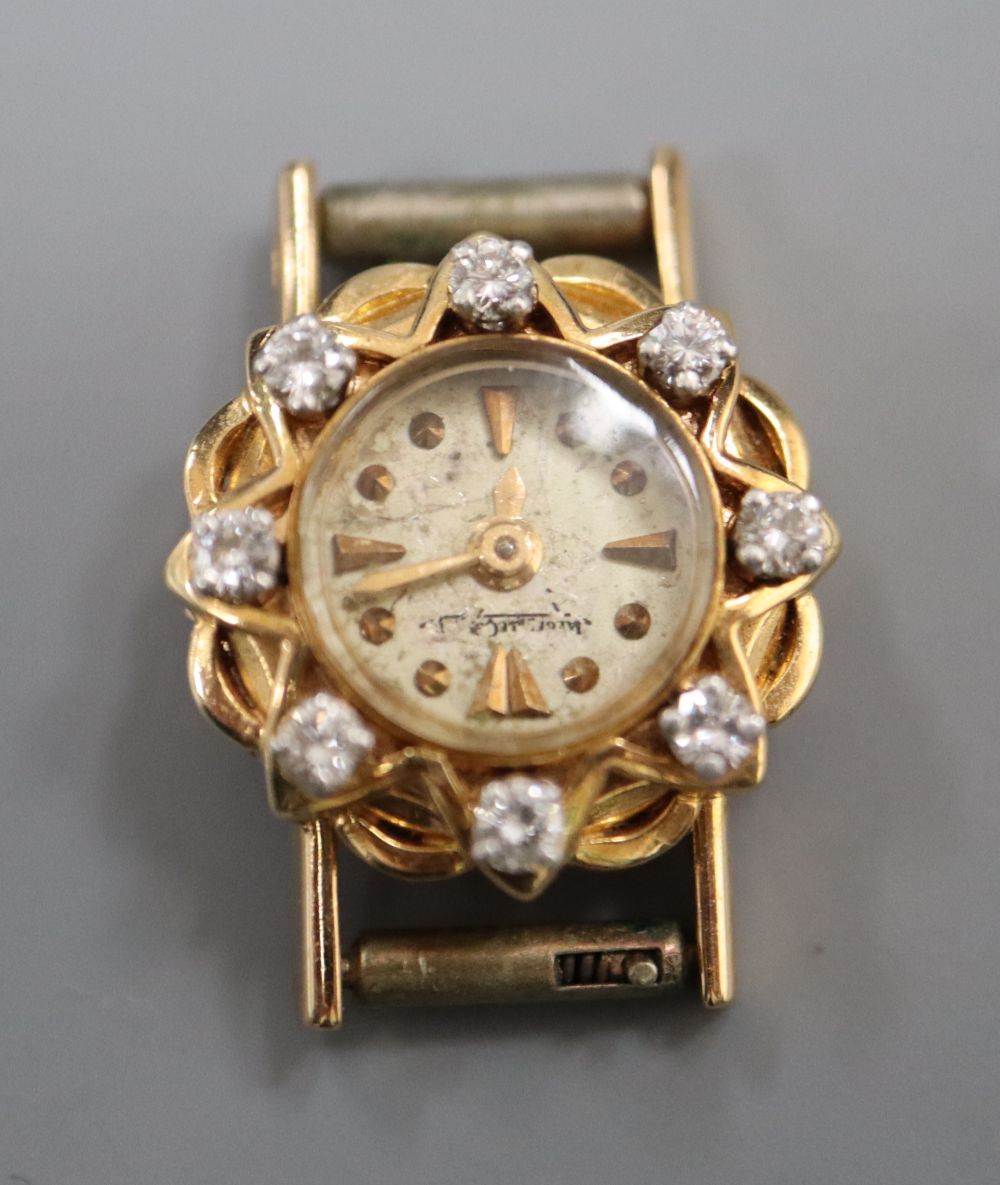 A ladys yellow metal and diamond set Jager LeCoultre manual wind wrist watch, diameter 16mm, gross 6.4 grams.